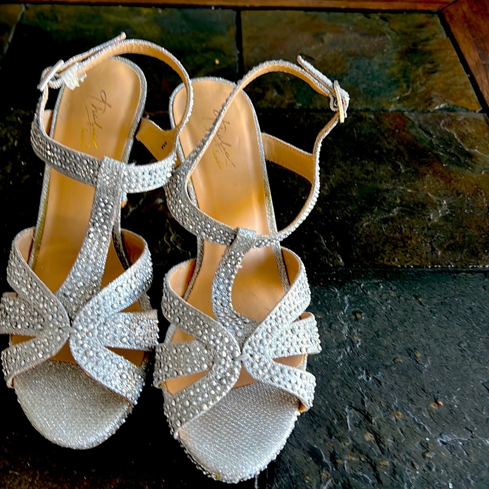 Silver sparkly studded size 8 shoes. Worn one time great for dressing up.